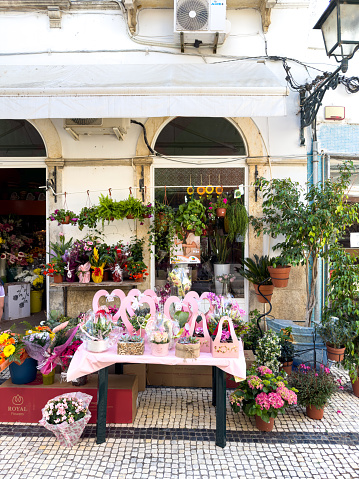 A busy flower shop on Mother's Day morning in Olhão, a city in the Algarve