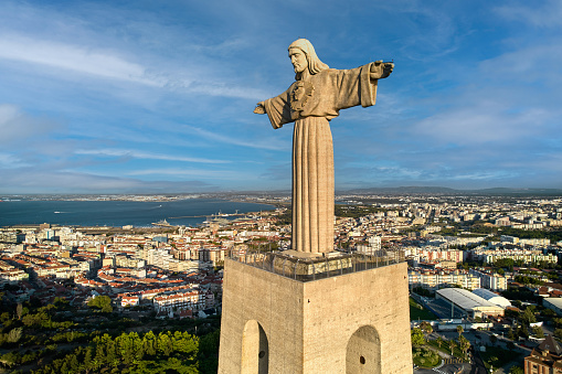 Enlightened Jesus Christ idol with arms outstretched in a welcoming manner.