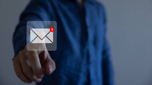 istock Businessman pressing messaging type of modern icons with virtual background. An email not read. 1580952876