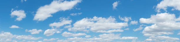istock Extra large panorama of blue sky with white clouds 1580995773