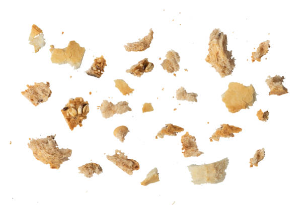 istock Fresh whole grain bread crumbs isolated on white background. Isolate crumbs of different sizes for inserting into a design or project. 1581001692
