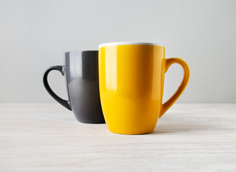 Two blank tea cups or coffee mugs. Responsive design mockup. Selective focus.