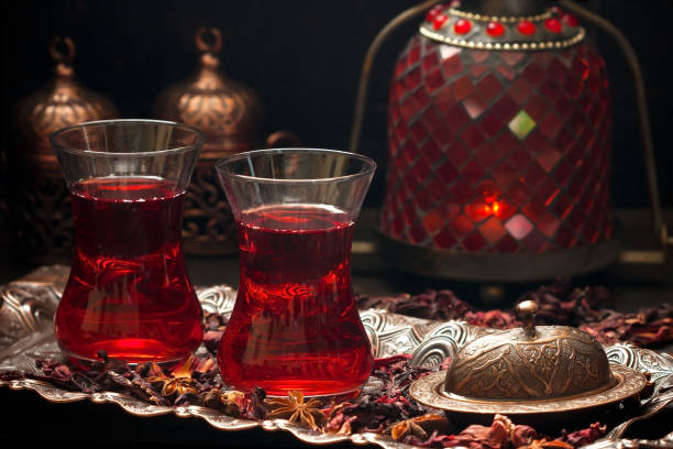 istock Karkade tea - red tea in Turkish cups on dark background 1581084042
