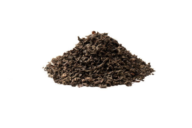 istock Dried tea leaves isolated on a white background. 1581087236