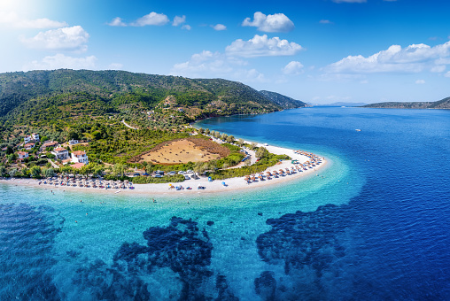 Aerial view of the popular beach at Agios Dimitrios, Alonissos island, Sporades, Greece, with turquoise and emerald sea