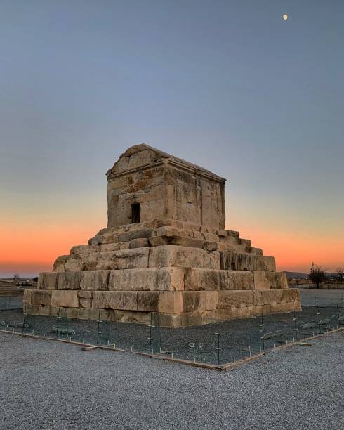 Sunset at Tomb of Cyrus the Great, Pasargadae, Iran The Tomb of Cyrus is the final resting place of Cyrus the Great, the founder of the ancient Achaemenid Empire. The mausoleum is located in Pasargadae, an archaeological site in the Fars Province of Iran. persian empire stock pictures, royalty-free photos & images