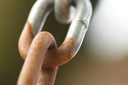 galvanized steel chain links with rust close-up