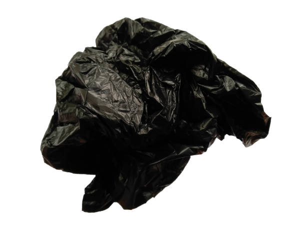 istock Black plastic for trash cans or shopping bag. Black plastic bag isolated on white background 1581129743