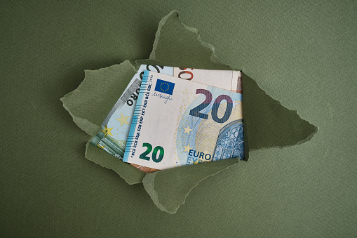 Close-up of euro banknotes. Various money in the background. The concept of finance, business, investment