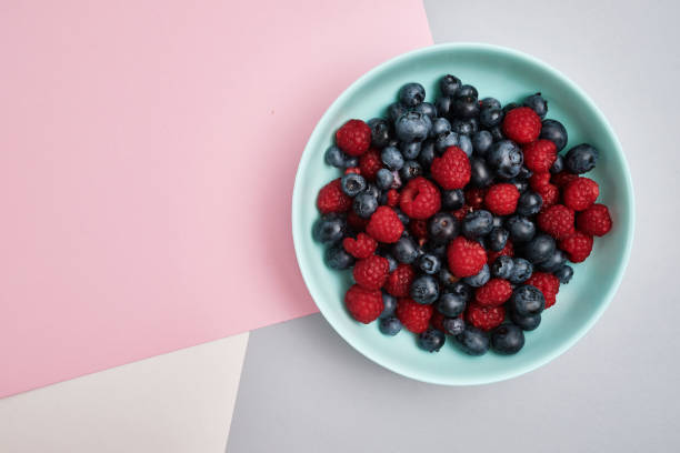 istock Plate with delicious raspberry strawberries and blueberries on a light background. Fresh organic berries and fruits. Farm ecological product. Without GMO. Fresh vitamins 1581147067