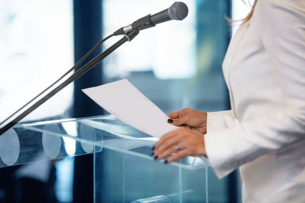 istock Woman speaking publicly 1581148128