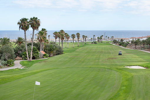 Amarilla Golf, Tenerife, Canary Islands, Spain - June 23, 2023: popular 18-hole golf course nested in the tranquil holiday resort displaying superb views towards the Atlantic and nearby small marina.