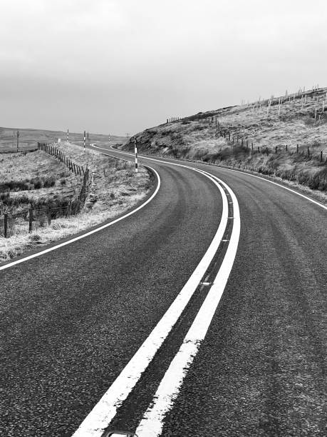 istock Road bends to the left ahead 1581221736