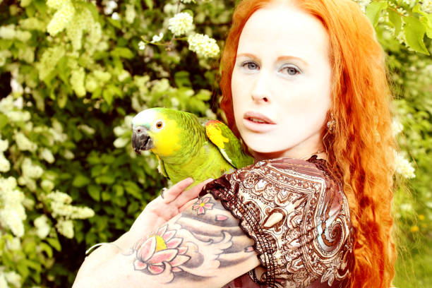 istock (Me)Angela with bird Zach 1581239645