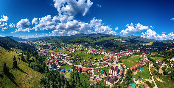 Aerial view of summer mountains range in Bukovel, Carpathian mountains, Ukraine. Travel vacation landscape, panoramic view