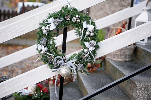 Christmas wreath on the porch of the house. New Year decoration .