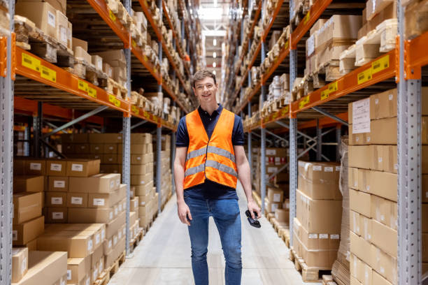 istock Portrait of a confident young man standing at distribution warehouse 1581299890