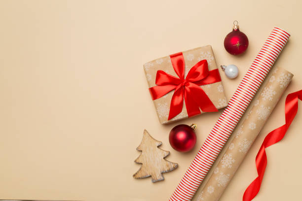 istock Gift boxes, paper's rools and decorations on color background, top view 1581311627