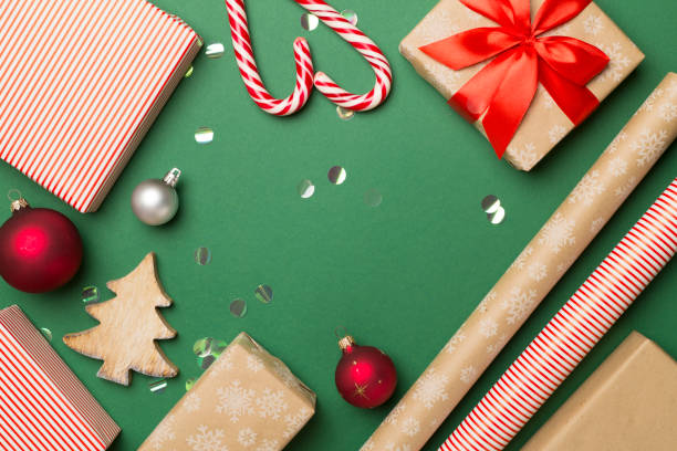 istock Gift boxes, paper's rools and decorations on color background, top view 1581311633