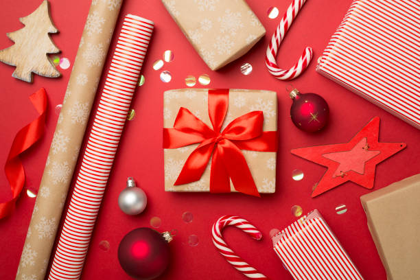 istock Gift boxes, paper's rools and decorations on color background, top view 1581311634