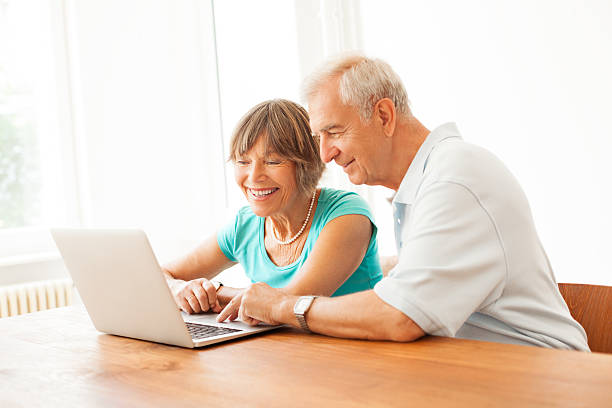 istock Happy senior couple navigating the internet 158134843
