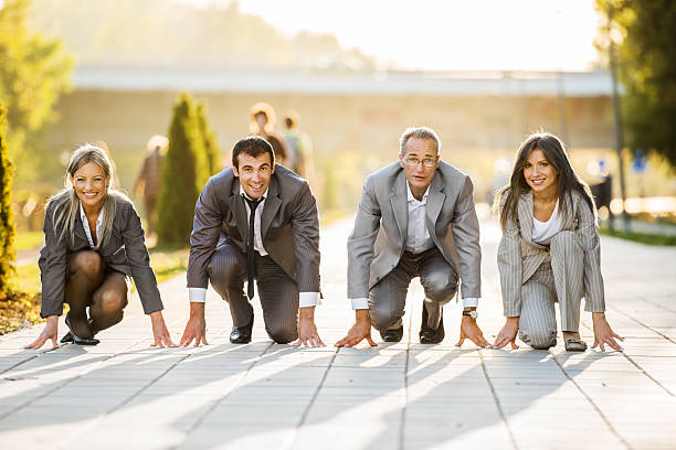 Businesspeople on a starting line, ready to run