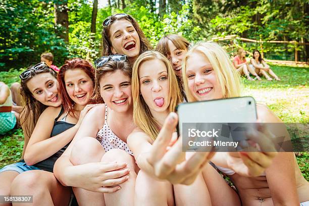 Girls Together Summer Camp Snapshot Stock Photo - Download Image Now - Summer Camp, Teenager, Mobile Phone