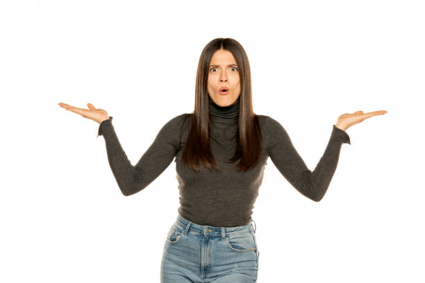 istock Young excited woman on isolated white background presenting an idea 1581410533