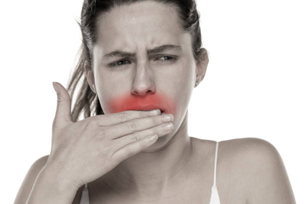 istock Young woman with toothache on a white background 1581429895
