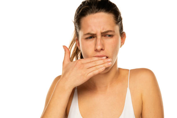 istock Young woman with toothache on a white background 1581431516