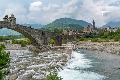 View of Bobbio and its famous landmark, the Old Bride (known in Italian as Ponte Gobbo), Emilia-Romagna, Italy