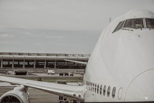 Washington, DC, United States - May 5, 2019: A Boeing 747 passenger airliner parked at a gate at Dulles International Airport.