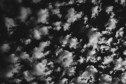 Belfast, Northern Ireland, UK - June 13, 2023: altocumulus clouds photographed from below.