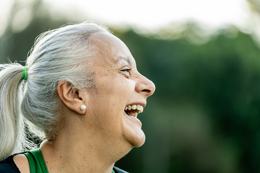 Portrait of smiling mature woman in park