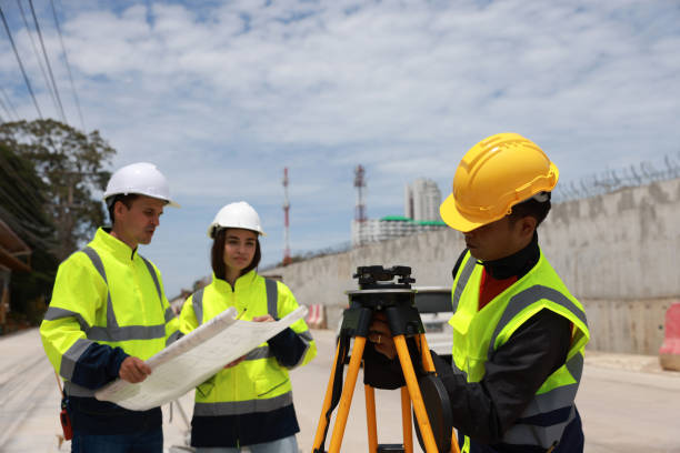 istock Construction engineer talking to architect at industrial construction site in road construction site 1581515020