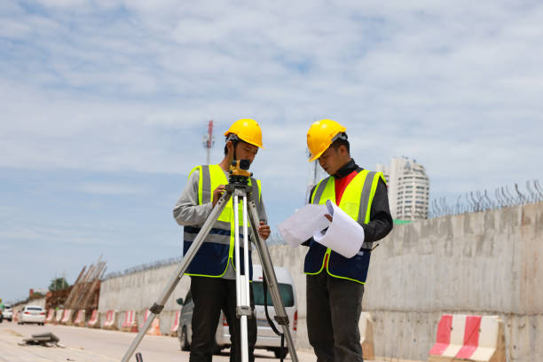 istock Construction concept of  Engineer foreman discussion work control to new road project  working in site. 1581515033