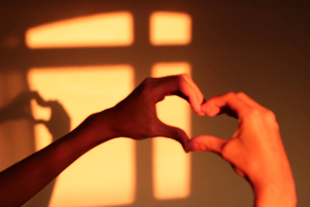 istock Child Making Heart Symbol with Hands 1581536950