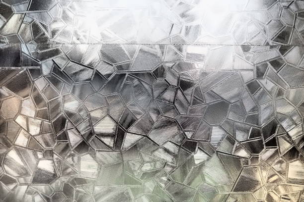istock Fluted glass with backlight. Beautiful multicolored refraction of light. Abstract background. Self-adhesive film. Ribbed glass surface. Embossed glass background 1581609277