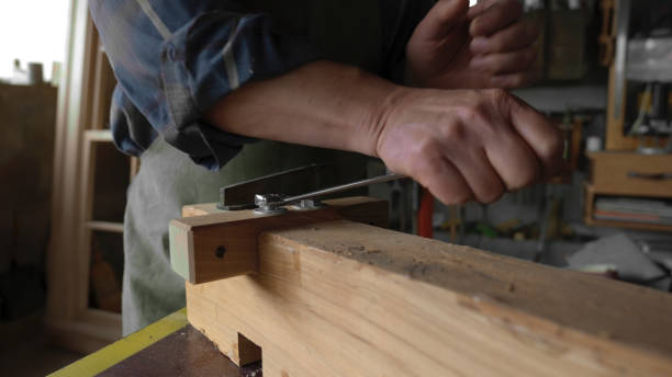 istock Carpenter working in his workshop.Small business owner. 1581618837