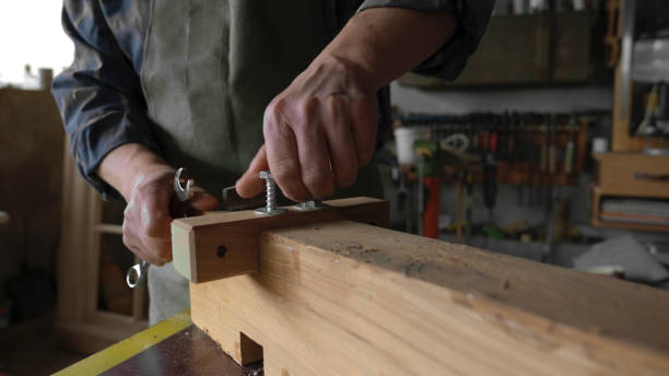 istock Carpenter working in his workshop.Small business owner. 1581618844