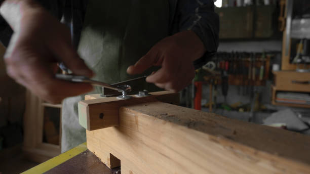 istock Carpenter working in his workshop.Small business owner. 1581618846