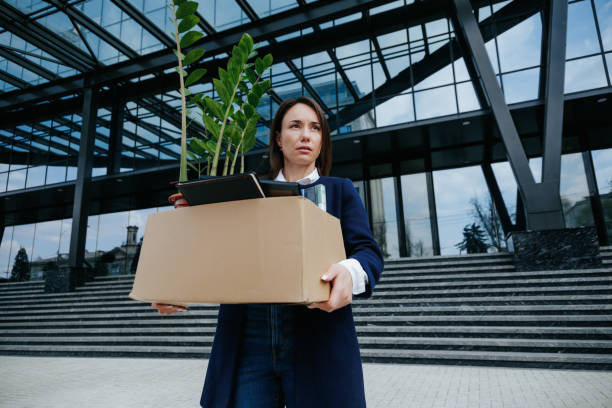 istock Surviving the Crisis Unfortunate Woman Grasping Cardboard Box 1581618883