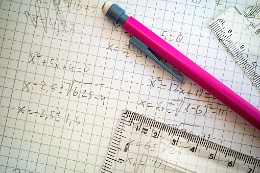 Stockholm, Sweden Mathematics equations on a piece of paper with a pen and a ruler.