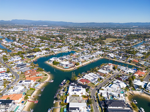 Aerial view of waterfront homes and hi-rise buildings at Broadbeach, Gold Coast, Australia