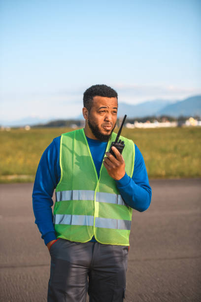 istock Latin Airfield Operations Officer Reporting In 1581631305
