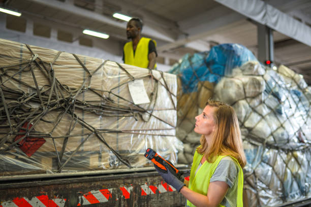 istock Diverse Airport Warehouse Coworkers Moving Cargo 1581633095