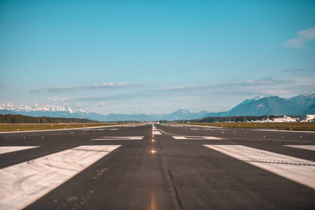 istock Airport Runway Under The Alps 1581634902