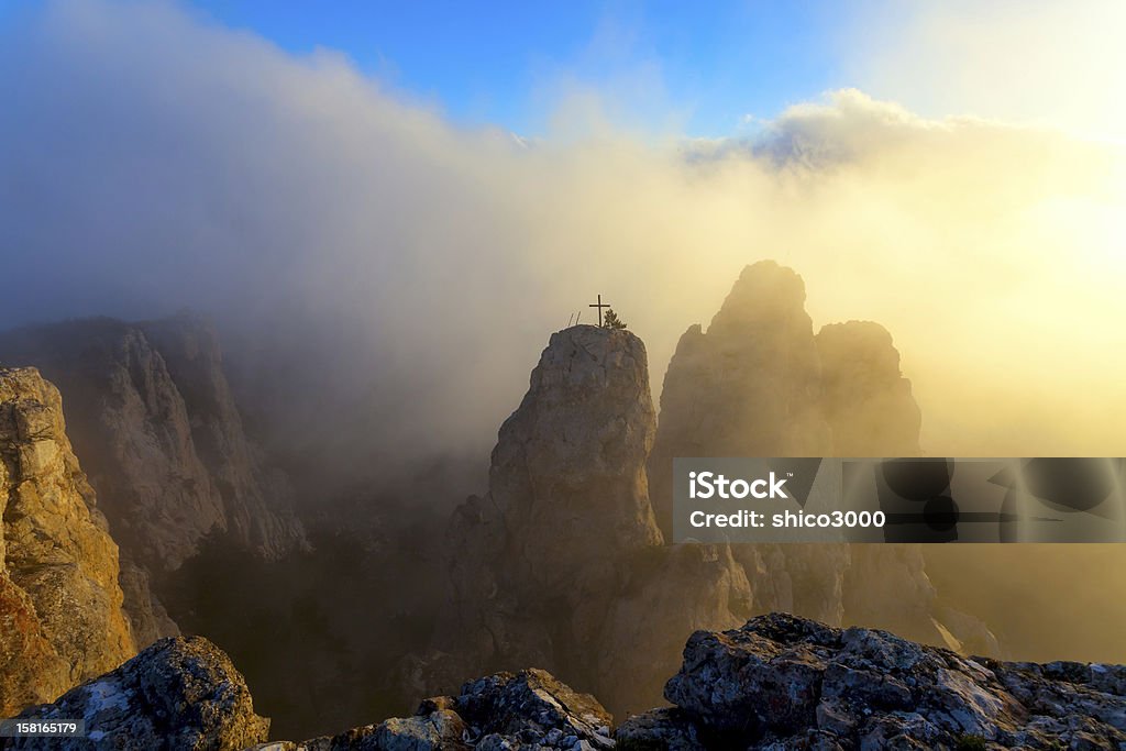 sunset and mountain landscape tree and fog At The Edge Of Stock Photo