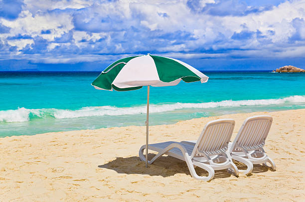 istock Chairs and umbrella at tropical beach 158165736