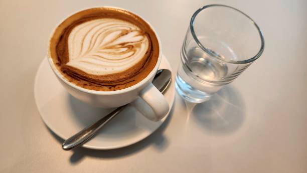 istock Cappuccino with half cup of plain water 1581700472